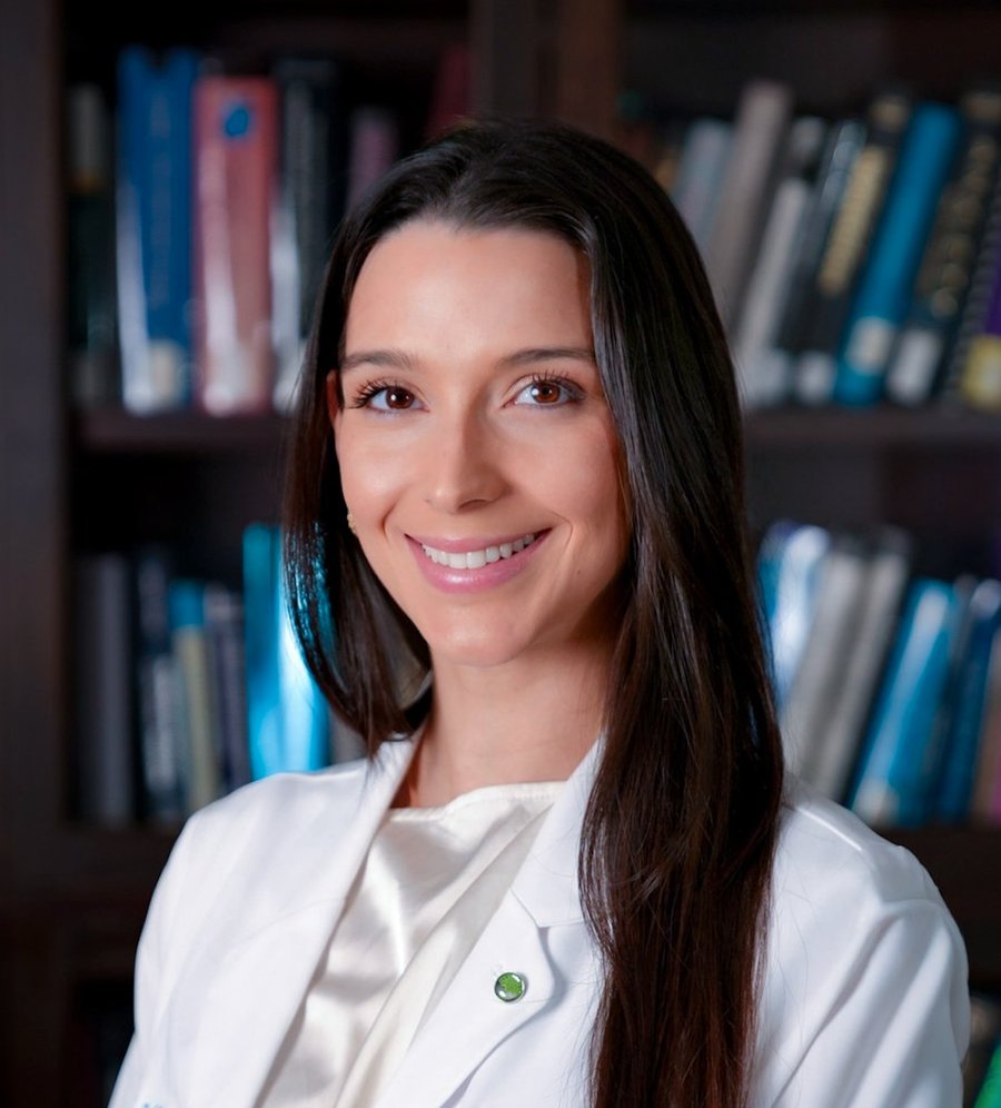 Portrait of Dr. Ana Zaldivar, M.D., wearing a white coat.